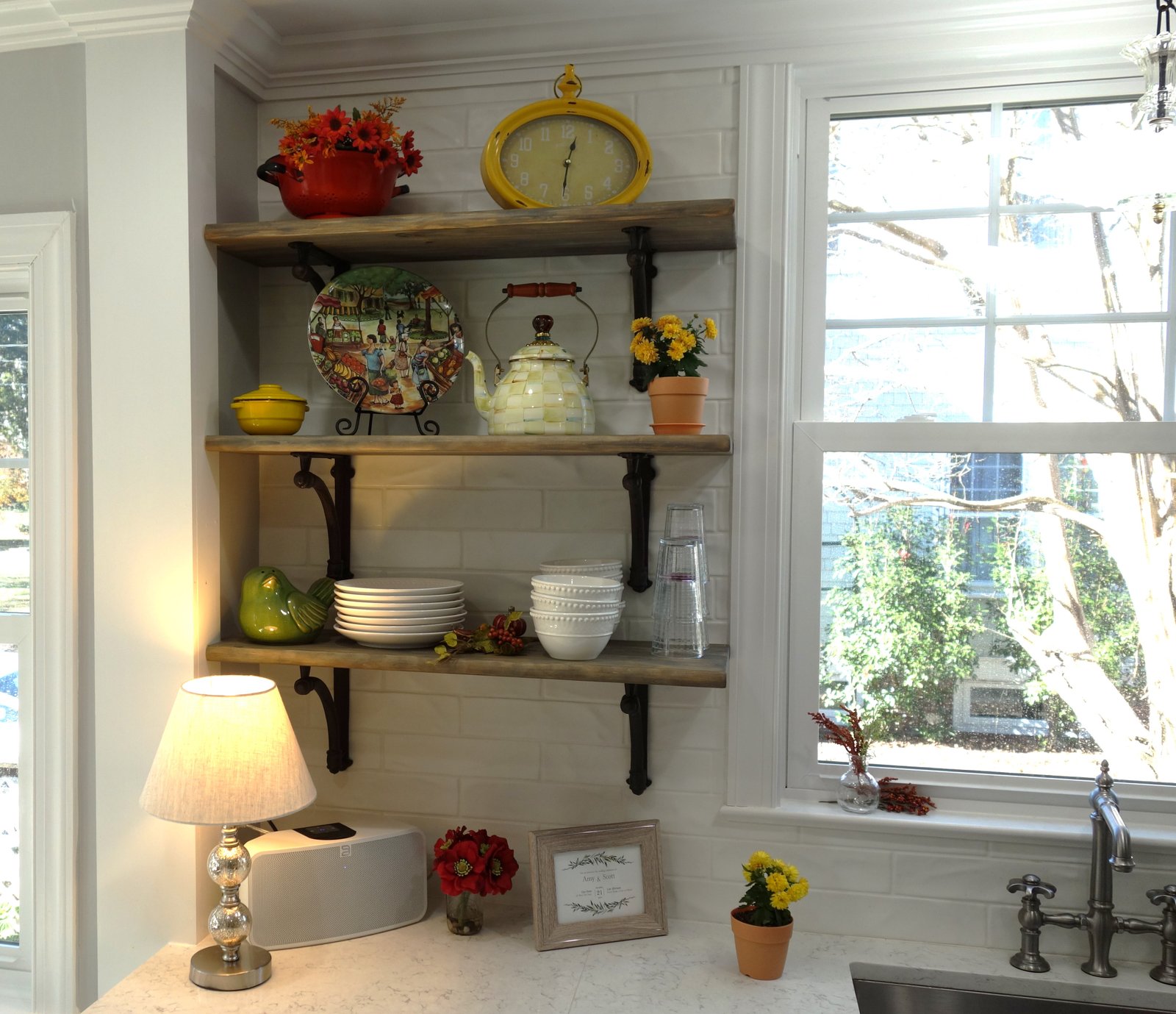 Suggestions For A Successful Kitchen and Bath Remodel. open wood shelving with black iron corbels 
