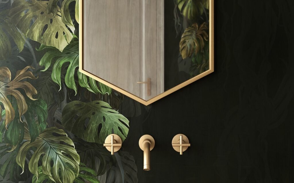 Easy Biophilic Bath ideas shoer wall in black with gold fixtures and painted on leaves